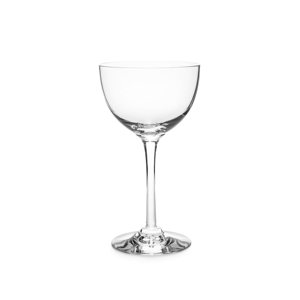 Indulge in the luxurious charm of the Vintner Nick & Nora Glass from Simon Pearce. Named after the iconic detectives, this glass features an upsized bowl for effortless mixing and sipping. With a thin rim and elegant stem design, it's perfect for your favorite cocktails.