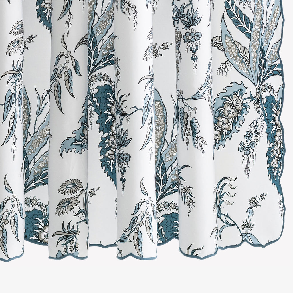 Elevate your bathroom with the Apolline Shower Curtain. Designed by Schumacher, this elegant curtain features a stunning botanical print on crisp, white Egyptian cotton. With a delicate embroidered scallop edge, it adds classic sophistication to any space. Made in the USA with OEKO-TEX® certified fabric from Italy.