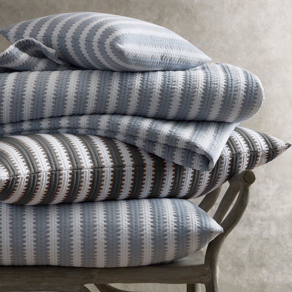 Expertly crafted in the USA with luxurious Italian fabric, Matouk's Apollo Stripe Matelassé coverlet and shams offer a comfortable and casual addition to your bedding. The 100% cotton shell and poly fill provide a minimal yet textural layer in a choice of Comet taupe or Dove blue & grey hues.