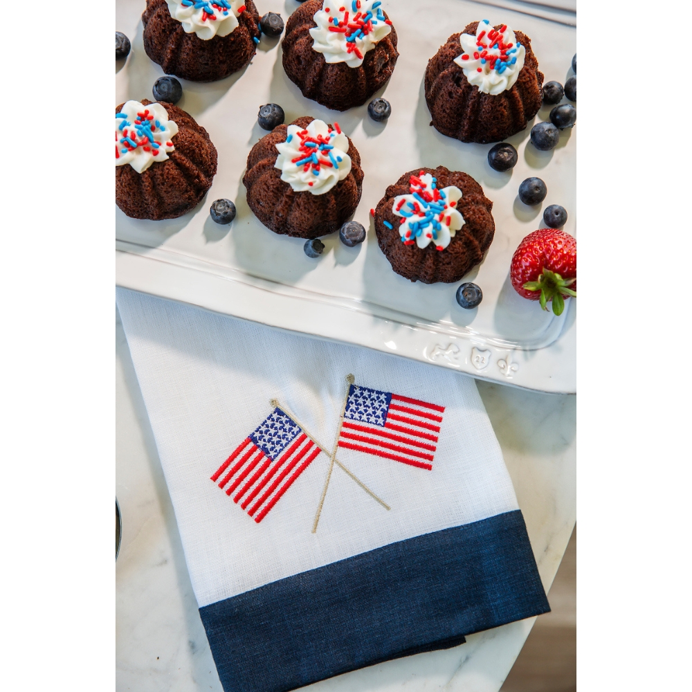 This American Flag Linen Towel is a must-have for any home. Made from 100% European linen and embroidered with delicate American flags, this guest towel is a perfect addition to your kitchen or bath. Measuring 17x29", it's a versatile way to add a touch of patriotism to any space. Made in Ukraine.