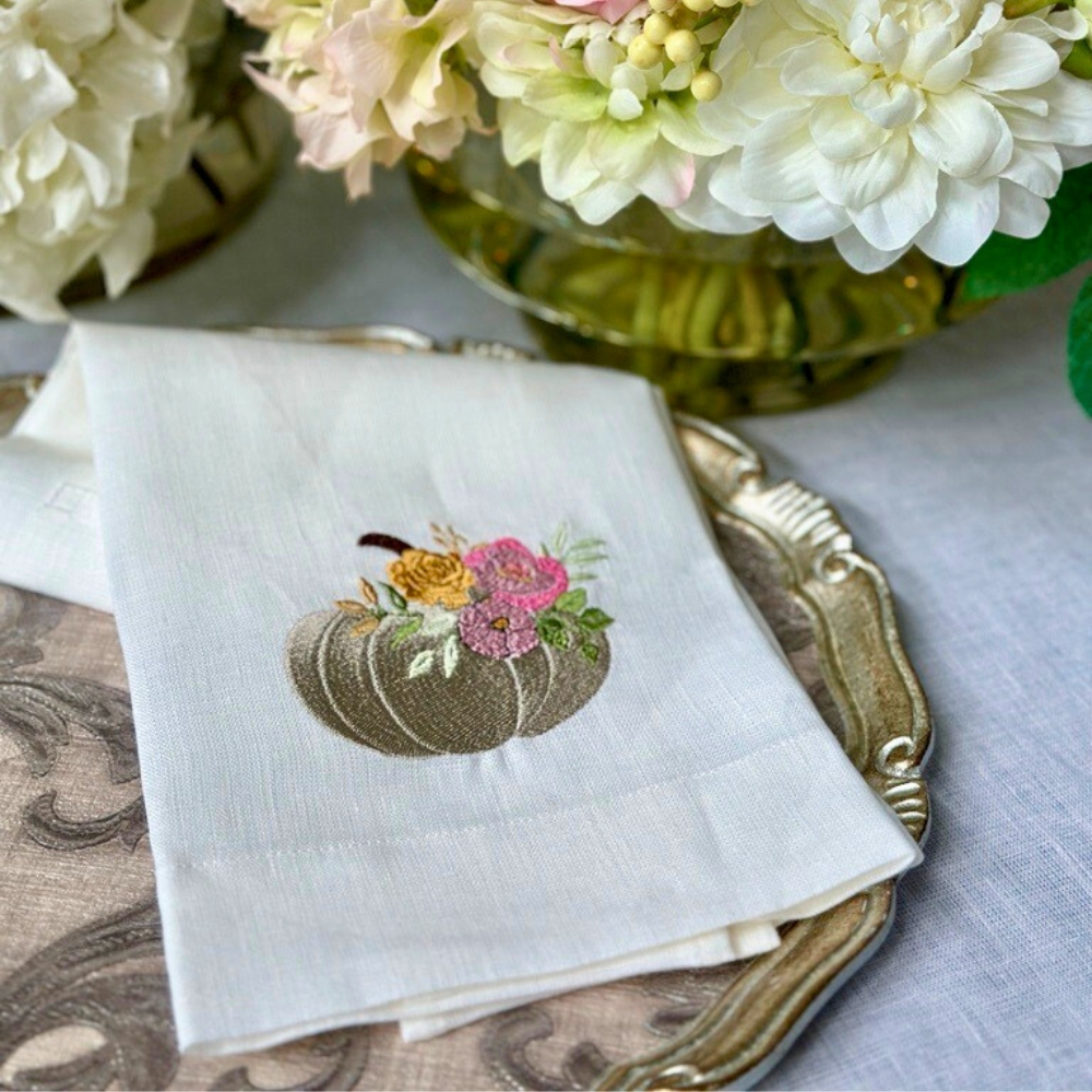 Add a touch of elegance to your kitchen or bathroom with our Floral Pumpkin Towel. Crafted from 100% embroidered European linen, this guest towel features a white pumpkin design with garden florals. Measuring 17x29", it also includes a tab on the back for easy hanging and is made in Italy for exceptional quality.