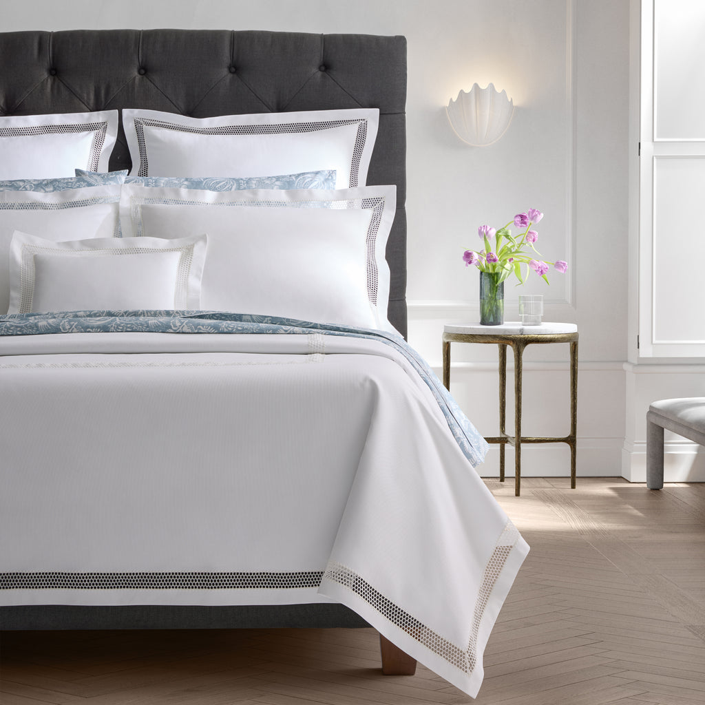 Introducing the Cecily Lace Pique Coverlet and Shams from Matouk, a perfect combination of timeless style and intricate detailing. Made with 100% cotton pique and finished with delicate white Swiss lace, this lightweight layer adds a polished finish to any bed.