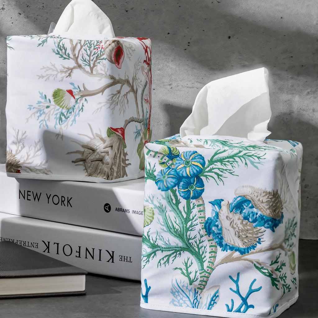 Introduce elegance to your home with Matouk's Del Tesoro Tissue Box Cover. Featuring vibrant hues and playful deep sea life motifs, printed on 100% cotton percale with a 500 thread count. Made in the Philippines with Italian fabric and OEKO-TEX certified. Transform unsightly tissues into a beautiful design statement. Sea Blue or Coral Print on white background