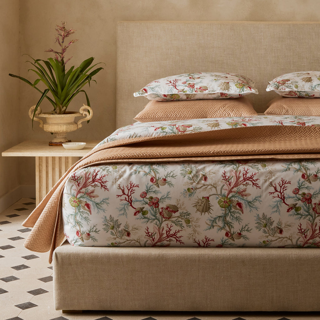 Experience the ultimate luxury with Del Tesoro sheets, duvet covers, and shams. Celebrating the underwater world with vibrant coral and playful motifs, this collection is crafted from luxurious Egyptian cotton, woven and printed in Italy. Elevate your bedding to new depths of elegance and sophistication