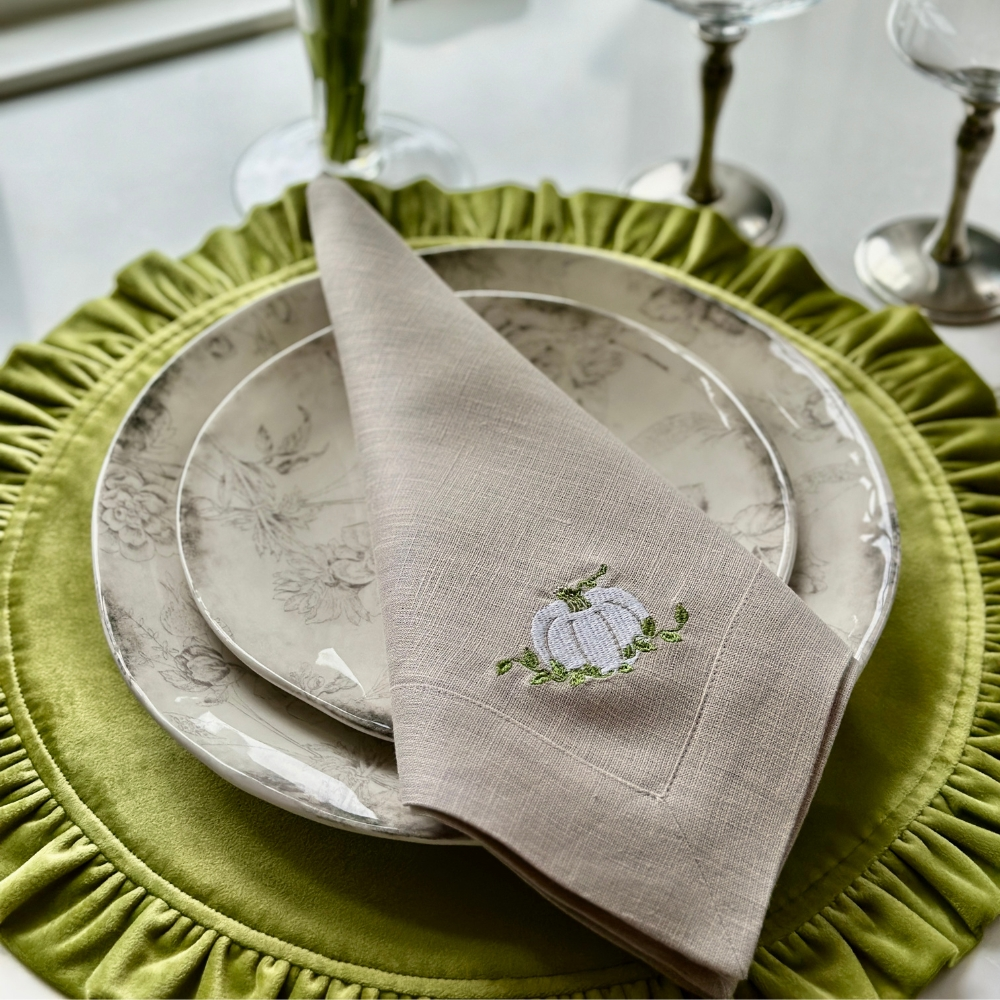 Introduce timeless elegance to your home with Crown Linen Designs Pumpkin Large Napkin. Adorned with exquisite white pumpkin embroidery, this napkin comes in natural linen. Pair with a runner, table topper or placemats for a complete look. Made in Italy, machine wash and dry flat for a crisp finish.