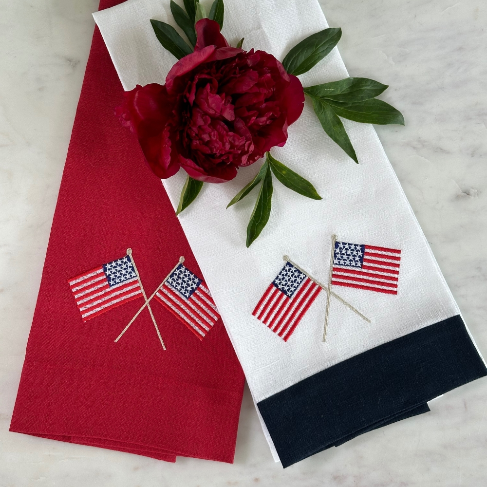 This American Flag Linen Towel is a must-have for any home. Made from 100% European linen and embroidered with delicate American flags, this guest towel is a perfect addition to your kitchen or bath. Measuring 17x29", it's a versatile way to add a touch of patriotism to any space. Made in Ukraine.