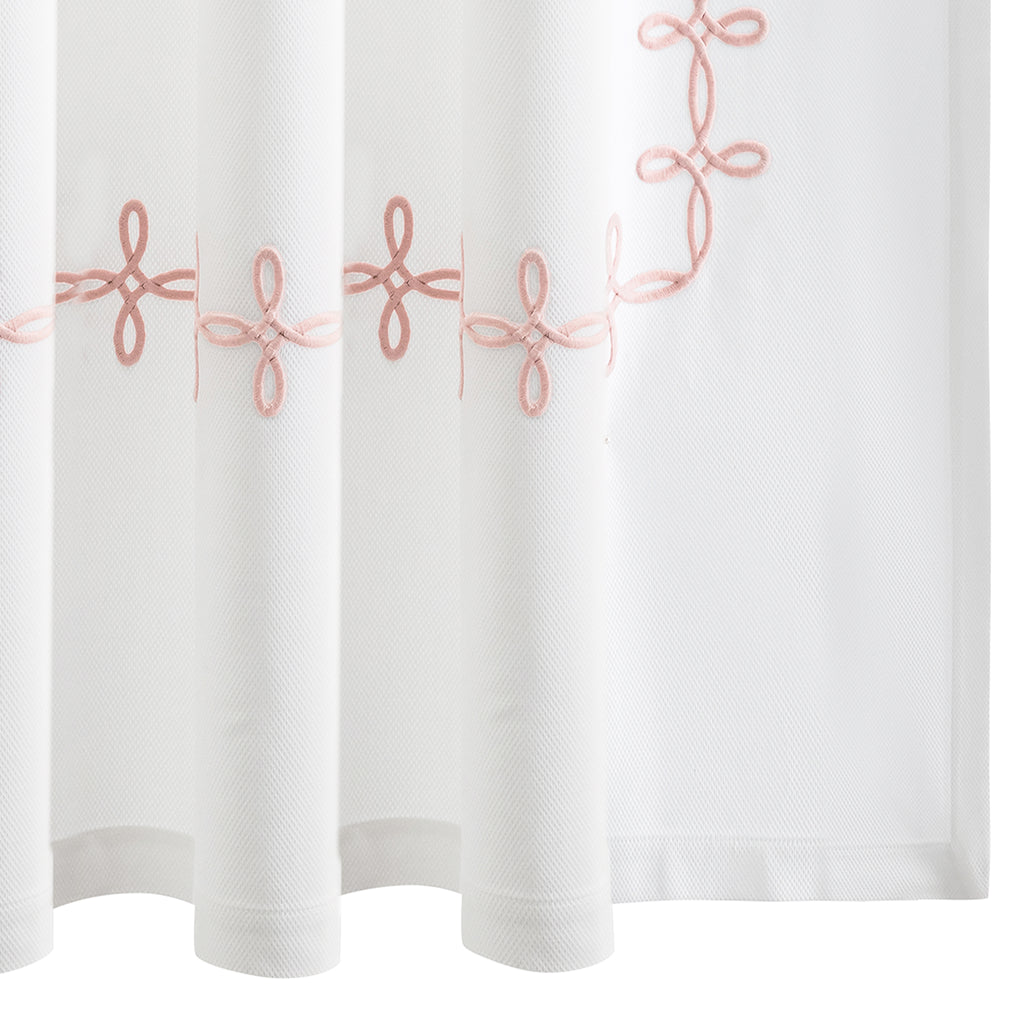 Elevate your bathroom with our elegant Gordian Knot Shower Curtain from respected bath and bed designers at Matouk. Crafted with a Grecian inspired pattern in Blush pink embroidered color, our timeless design is meticulously perfected on white pique fabric. Experience luxury every time you step into your shower.