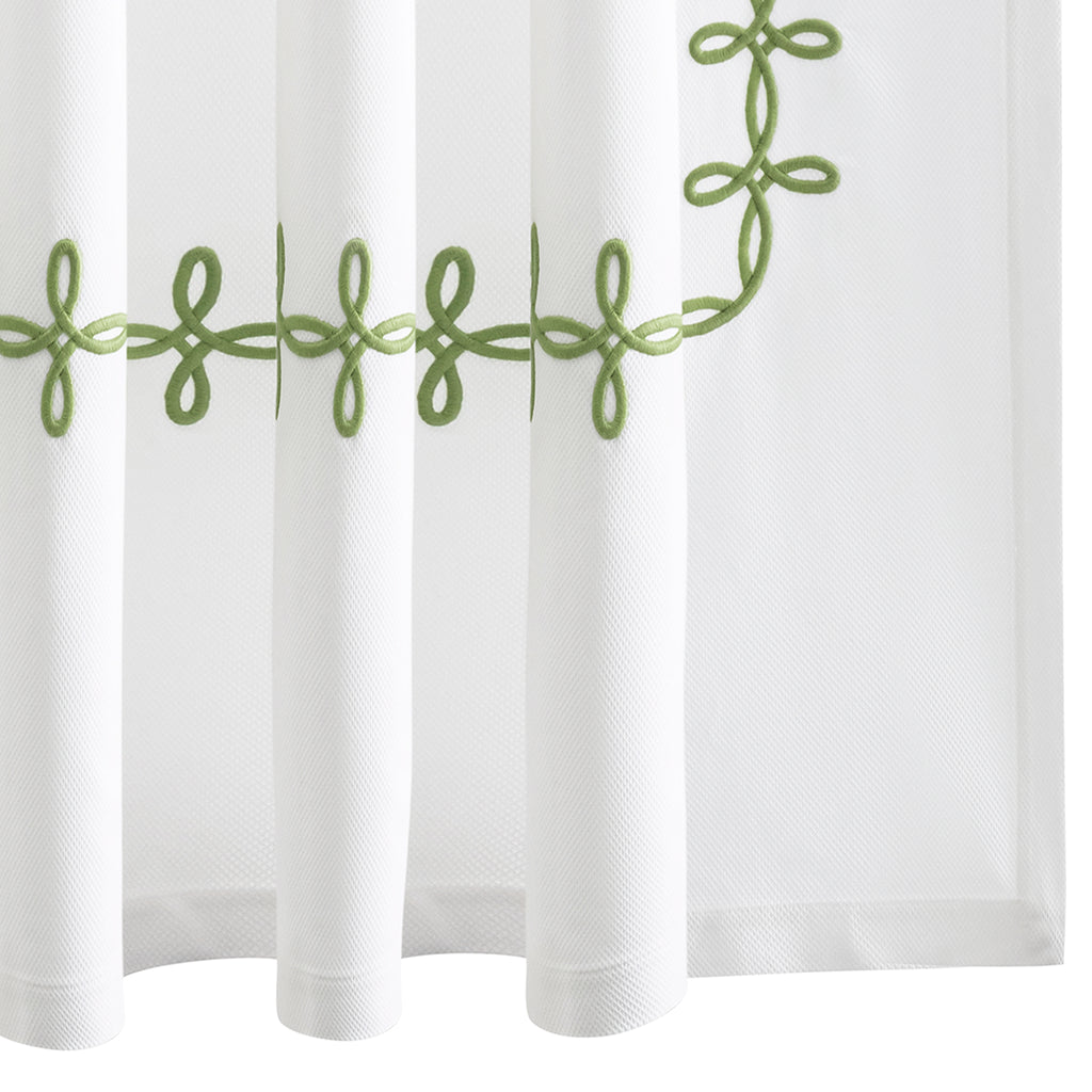 Elevate your bathroom with our elegant Gordian Knot Shower Curtain from respected bath and bed designers at Matouk. Crafted with a Grecian inspired pattern in Spring Green embroidered color, our timeless design is meticulously perfected on white pique fabric. Experience luxury every time you step into your shower.