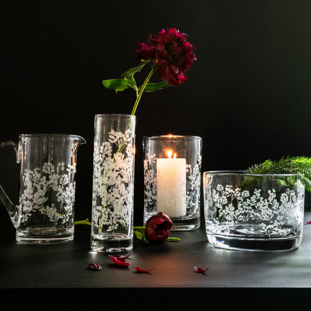 Expertly crafted by Simon Pearce, the Engraved Berry glassware features a beautiful block print of wild berry brambles. This nature-inspired design adds a touch of elegance to any home bar or breakfast table. Enjoy the perfect blend of style and functionality with this collection.