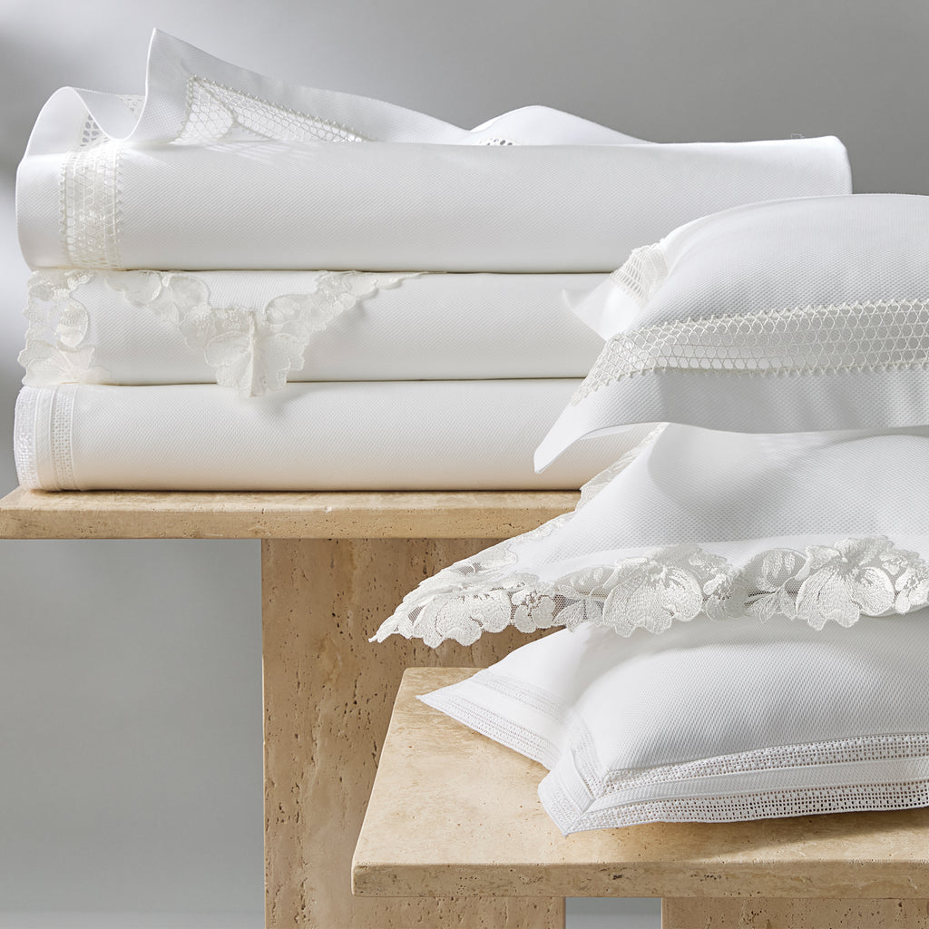 Introducing the Lace Pique Coverlet and Shams from Matouk, a perfect combination of timeless style and intricate detailing. Made with 100% cotton pique and finished with delicate white Swiss lace, this lightweight layer adds a polished finish to any bed. Available in styles Cecily, Grace, and Virginia.