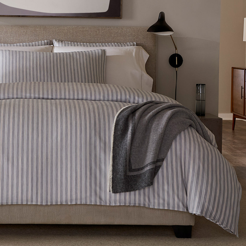 Indulge in luxury with our Leranto Sheets, Duvet Covers + Shams. Made from 100% extra long-staple cotton, the yarn-dyed sateen jacquard fabric gives a softly textured feel. The minimalist palette of titanium, adorned with understated stripes, exudes elegance and sophistication. Made in Italy.