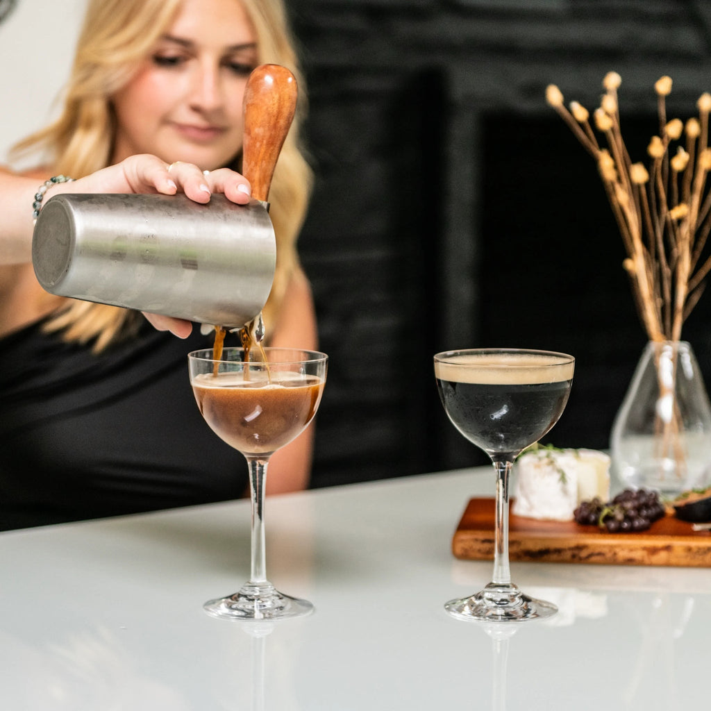 Indulge in the luxurious charm of the Vintner Nick & Nora Glass from Simon Pearce. Named after the iconic detectives, this glass features an upsized bowl for effortless mixing and sipping. With a thin rim and elegant stem design, it's perfect for your favorite cocktails.