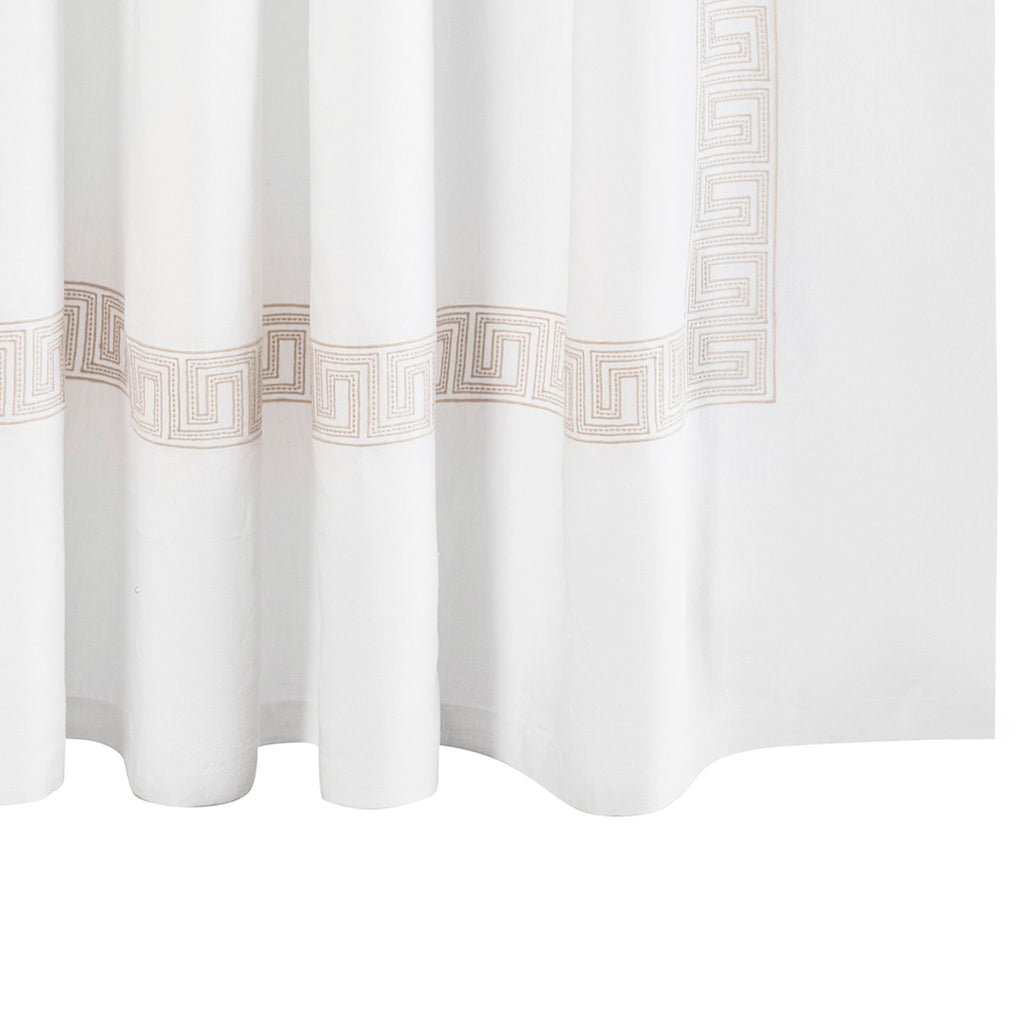 The Ophelia Shower Curtain by Matouk features a timeless Greek key pattern crafted from 100% linen. The embroidered Dune Tan  lines and dots add a touch of elegance to any bathroom. Inspired by Schumacher's beaded tape, this curtain offers a classic look that is both refined and beautiful.