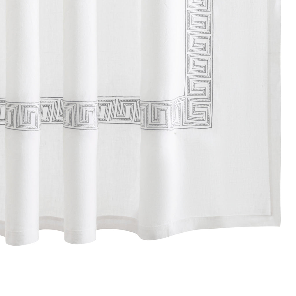 The Ophelia Shower Curtain by Matouk features a timeless Greek key pattern crafted from 100% linen. The embroidered Sterling silver lines and dots add a touch of elegance to any bathroom. Inspired by Schumacher's beaded tape, this curtain offers a classic look that is both refined and beautiful.